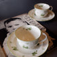 Green floral cup and saucer